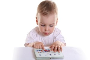 baby with book 2 image by Pavel Losevsky from Fotolia.com Writing