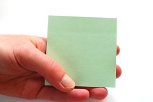 holding card #5 image by Adam Borkowski from Fotolia.com Something