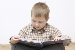 little boy reading a book image by Renata Osinska from Fotolia.com Learn