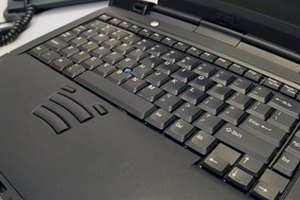 laptop with phone in background image by Jake Hellbach from Fotolia.com Whether you use the telephone or your computer, it will take time to find someone in police custody.