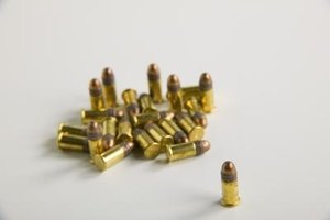 Jupiterimages/liquidlibrary/Getty Images The .22-caliber rimfire cartridge gives the Ruger 22 Charger light recoil and permits the use of a wide variety of scopes.