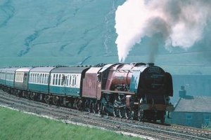 Jupiterimages/Photos.com/Getty Images Locomotives have developed drastically in strength and efficiency since its inception in the early 1800s.