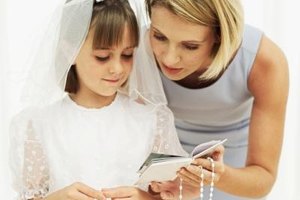 George Doyle/Stockbyte/Getty Images Children traditionally receive a rosary when they receive their first communion, which is the Catholic sacrament of the Eucharist.