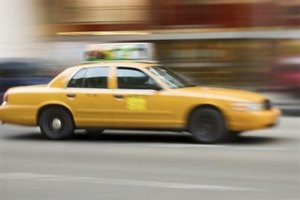 Thinkstock Images/Comstock/Getty Images In some cases, taxi vouchers allow eligible passengers to travel to areas that go beyond fixed bus routes.