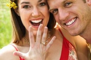 Jupiterimages/Comstock/Getty Images Saying something such as "I'm so happy for you!" is fitting when acknowledging a couple's engagement.