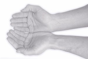 help me hands in blue image by Jörg Jahn from Fotolia.com National Volunteer Week encourages Americans to open their hears and work with their hands to serve their communities.