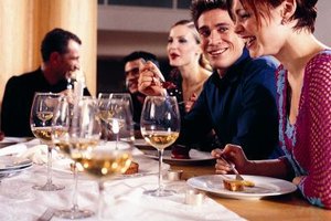 Photodisc/Photodisc/Getty Images Experts agree that it would be better to reduce the guest list or food options than ask guests to pay (See Ref. 1,2).