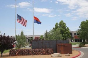 Christian Petersen/Getty Images News/Getty Images The American and State of Arizona flags fly at half mast to honor fallen firefighters killed in Yarnell Hills wildfire in July 2013