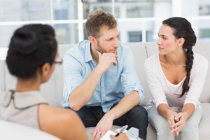 Wavebreakmedia Ltd/Wavebreak Media/Getty Images A therapist can help you and your husband work through his negativity and its effects on your marriage.