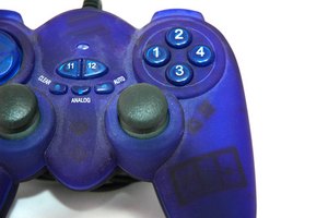 close up game pad blue image by Warren Millar from Fotolia.com Games