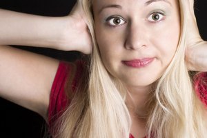 Los dolores de cabeza previos a la mestruación pueden ser síntomas del Síndrome Premenstrual.
