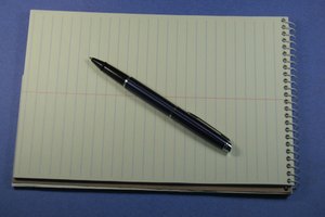 Pen and open steno pad, lots of space for your text image by Steve Johnson from Fotolia.com Learn