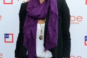Larry Busacca/Getty Images Entertainment/Getty Images Actress Molly Sims rocks a bright purple scarf for a fun pop of color with a black blazer and white tee.