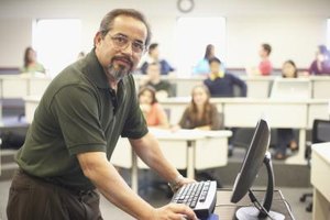 Jack Hollingsworth/Photodisc/Getty Images Graduates with a master's degree in educational technology can work as faculty managers in colleges.