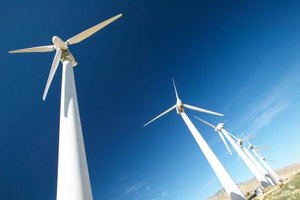 Hemera Technologies/AbleStock.com/Getty Images Wind turbines can be as tall as a 20-story building and have three 200-foot-long blades. (See Reference 4)