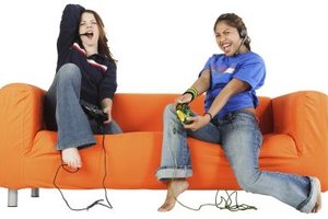 Photos.com/PhotoObjects.net/Getty Images Encouraging more girls to play video games counts as an important research area for video game colleges.