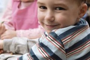 Comstock Images/Comstock/Getty Images Schools use benchmarks to measure what your child can do, while medical professionals use milestones to measure development.