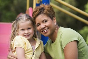 Jupiterimages/Comstock/Getty Images Parents consider factors such as maturity, experience and education when choosing a nanny or governess.