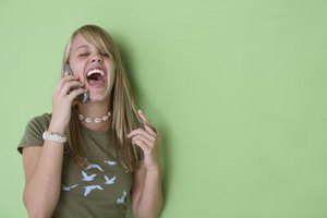 Jupiterimages/Brand X Pictures/Getty Images Talking on the phone is verbal communication, but teens also engage in many nonverbal forms of communication.