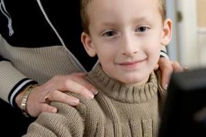 Jupiterimages/Photos.com/Getty Images Keep your child as safe as you possibly can while he uses the Internet, through filtering and reports.