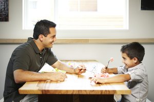 man and boy eating