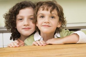 Jupiterimages/Creatas/Getty Images Closeness between siblings is affected by many factors, including the mental health of their parents.