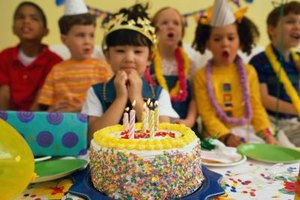 Ryan McVay/Photodisc/Getty Images When planning where to hold your child's birthday party, focus on your child's age and the guests attending.