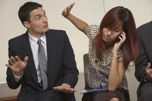 Comstock Images/Comstock/Getty Images Candidates who are distracted during an initial interview may not be called back for an in-person interview.