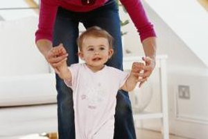 Stockbyte/Stockbyte/Getty Images Just because your baby is able to walk assisted, it doesn't mean he's ready for a pair of "big boy" shoes.