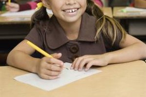 Jupiterimages/Brand X Pictures/Getty Images An essay in elementary school consists of an introductory paragraph, body paragraphs and a concluding paragraph.