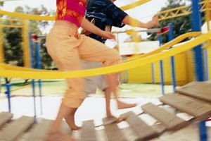 Digital Vision./Digital Vision/Getty Images Many typical playgrounds include equipment like a balance bridge, which can improve sensory integration.