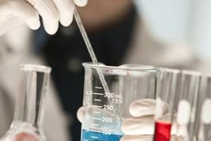 Comstock Images/Comstock/Getty Images Toxicologists conduct research on chemicals and environmental contaminants that might be harmful to humans.