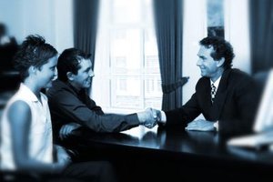 Stockbyte/Stockbyte/Getty Images Banks provide means for two or more people to be listed as account holders on a single joint account.
