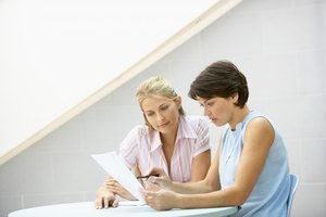 Women reading document