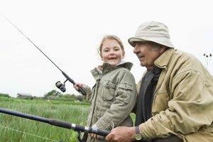 Grandfather and granddaughter fishing