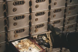 Thief stealing from safety deposit box