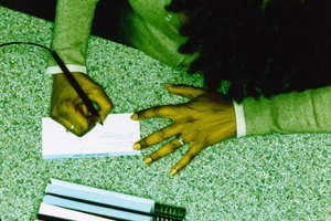Woman Writing on a Bank Deposit Slip