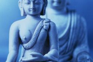 Stockbyte/Stockbyte/Getty Images A classical image of the Buddha in seated meditation, one of the key practices on the path to enlightenment.
