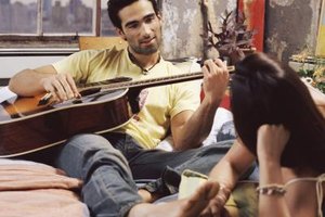 Digital Vision./Digital Vision/Getty Images A guitar-playing playing boyfriend can be very alluring; feet full of corns and calluses, not so much.