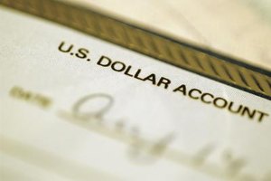 Medioimages/Photodisc/Photodisc/Getty Images Americans can have foreign bank accounts, but they need to be careful to file appropriate IRS paperwork.