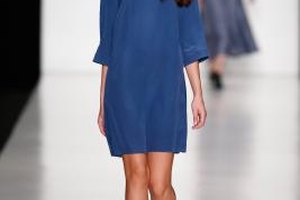 Andreas Rentz/Getty Images Entertainment/Getty Images A model shows off a shift in electric blue on the runway during Fashion Week in Moscow in October 2013.