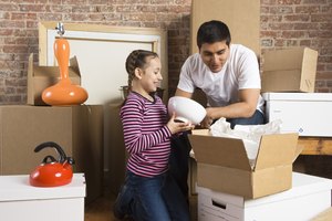 Father and daughter with moving boxes