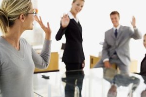 Stockbyte/Stockbyte/Getty Images Don't say goodbye to your co-workers until you've given the new employer written acceptance of a final offer.