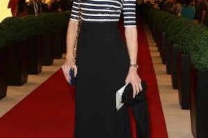 Neil P. Mockford/Getty Images Entertainment/Getty Images Eva Riccobono wears a sophisticated black skirt with her striped sweater at a Vogue fashion event in Dubai.