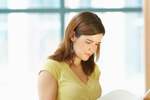 Woman reading office document