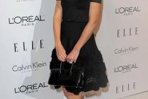 Jason Merritt/Getty Images Entertainment/Getty Images Katie Holmes pairs her lace ruffle skirt with a simple black top and pumps for a sophisitcated evening look.