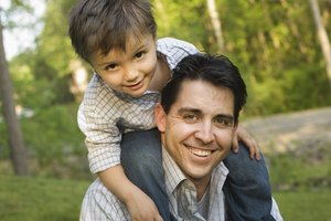 Father giving son a piggyback ride