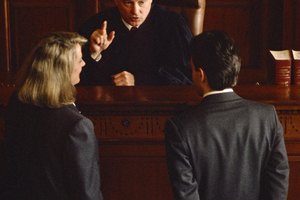 Lawyer, prisoner and judge in courtroom
