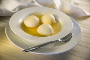 Jupiterimages/Creatas/Getty Images Matzoh ball soup is a traditional Jewish dish, but it needs to be carefully prepared according to Jewish religious rules to be considered kosher.