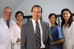 Jupiterimages/Photos.com/Getty Images Institutions offering a graduate degree in health care management train students to work in a variety of health care settings.